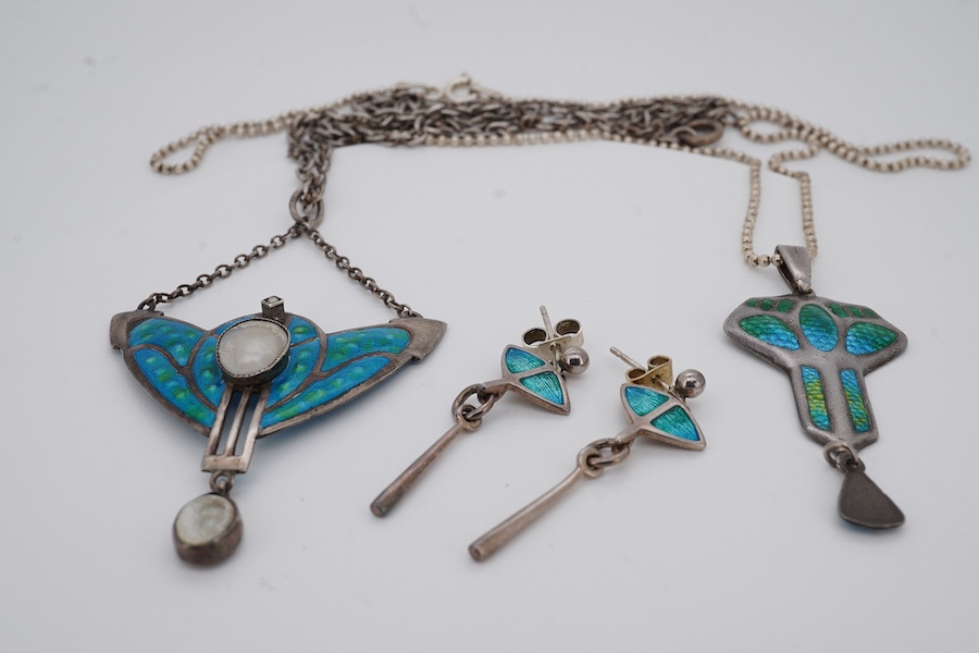 An Edwardian Art Nouveau silver and enamel drop pendant, by Charles Horner, Chester, 1908, 46mm, on a later 925 chain, together with one other Art Nouveau white metal, enamelled and mother of pearl set pendant necklace a